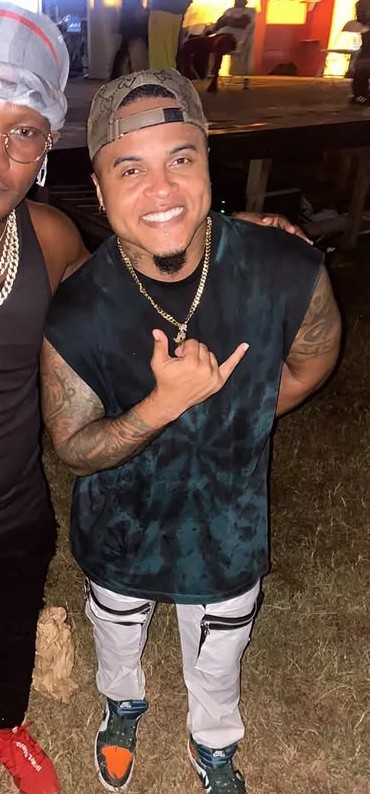 Ricardo Drue, on the right wearing a backwards cap